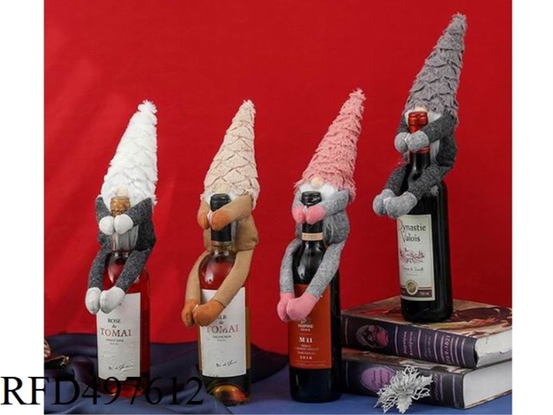 SANTA HOLDS A WINE BOTTLE TO DECORATE